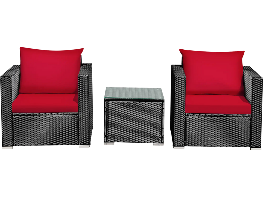 Two red-cushioned rattan chairs and a glass-top table, perfect for outdoor patio relaxation.