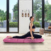 Adjustable pink gaming sofa with a person in a yoga pose, featuring breathable fabric and ergonomic support for comfort.