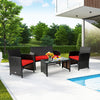 Four-piece patio rattan furniture set with red cushions, including loveseat, chairs, and tempered glass coffee table.