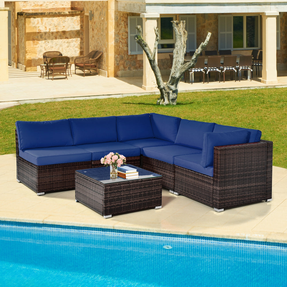 Navy 6-piece patio rattan furniture set with cushions and glass coffee table, perfect for outdoor relaxation by the.
