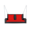 2-person patio rattan porch swing with red cushions, featuring solid steel chains for stability and comfort in outdoor.