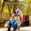 2-person patio rattan swing with cushions in a cozy outdoor setting, perfect for relaxing with friends or family.
