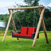 Rattan porch swing with red cushions, featuring a sturdy wooden frame and solid steel chains for outdoor relaxation.