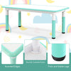 Kids table and chairs set in green with a graffiti desktop, featuring rounded edges and sturdy connections for safety.