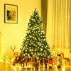 7-foot PVC artificial Christmas tree with warm white LED lights, surrounded by gifts and festive decorations for indoor.