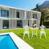 Outdoor cast aluminum patio furniture set with rose design in white, perfect for garden or poolside relaxation.