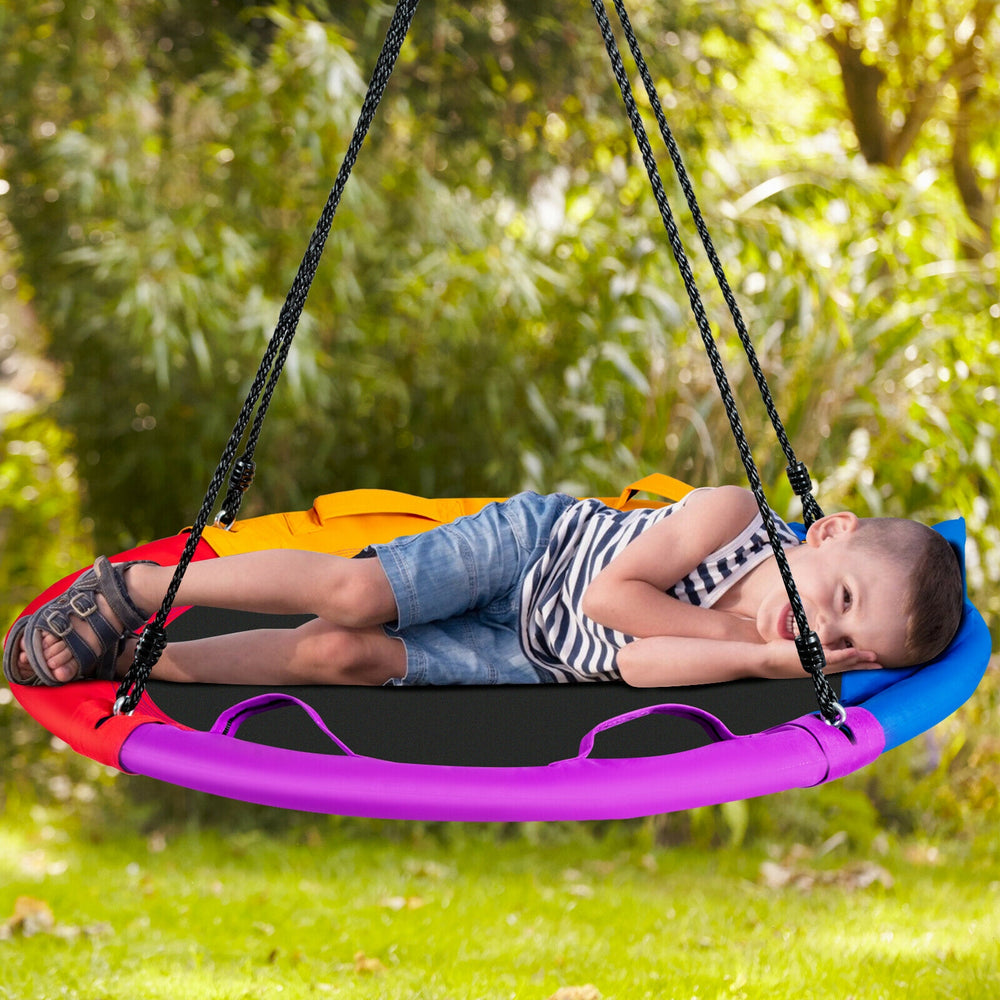 Colorful 40-inch saucer swing with pillow and handles, perfect for outdoor fun in the backyard for kids.