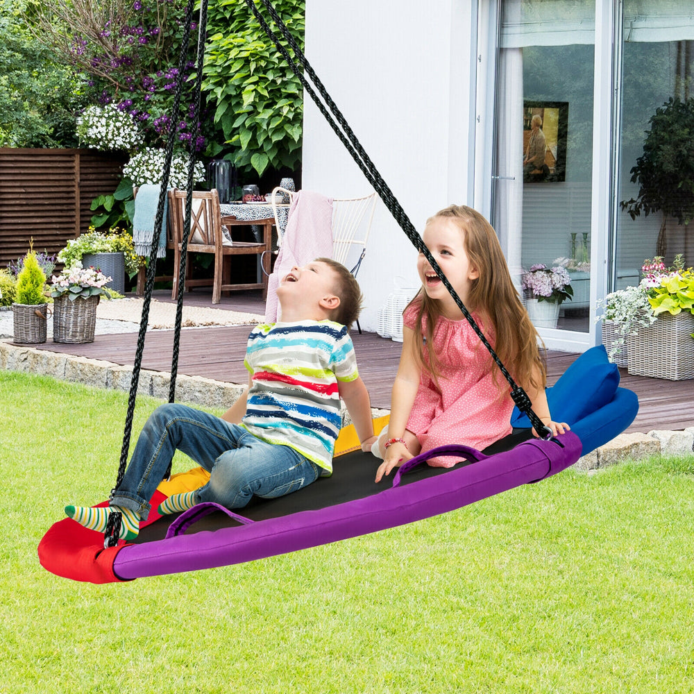 Colorful 40-inch saucer swing with pillow and handles, designed for outdoor use, perfect for kids' backyard fun.