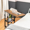 C-shaped adjustable bedside table in rustic brown with a laptop on top and a 2-tier wire shelf for extra storage.