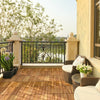Acacia wood interlocking patio deck tiles displayed on a balcony, offering a stylish outdoor flooring solution for.