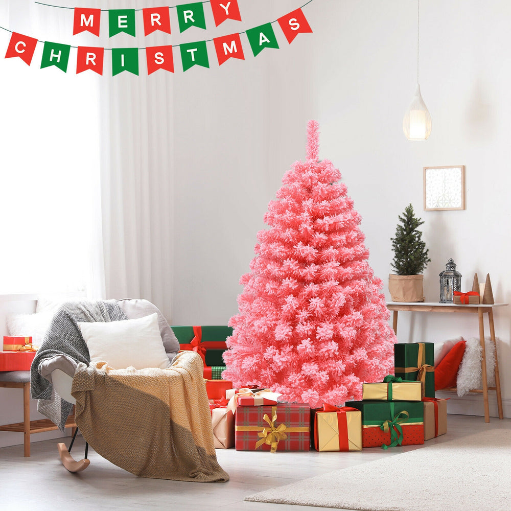 Pink Christmas tree with snow flocked PVC tips, 4.5 ft tall, surrounded by gifts for festive holiday decor.
