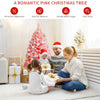 Pink Christmas tree with snow flocked PVC tips, 4.5 ft tall, perfect for festive decor in living rooms or commercial.