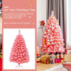 Pink Christmas tree with snow flocked PVC tips, 4.5 ft tall, perfect for DIY decoration in any festive setting.