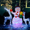 5-foot tall inflatable snowman with colorful LED lights, surrounded by light-up reindeer, creating a festive outdoor.