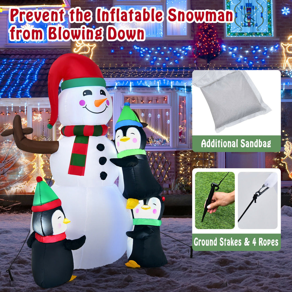 6ft inflatable Christmas snowman with penguins, waterproof fabric, bright lights, perfect for lawn decoration.