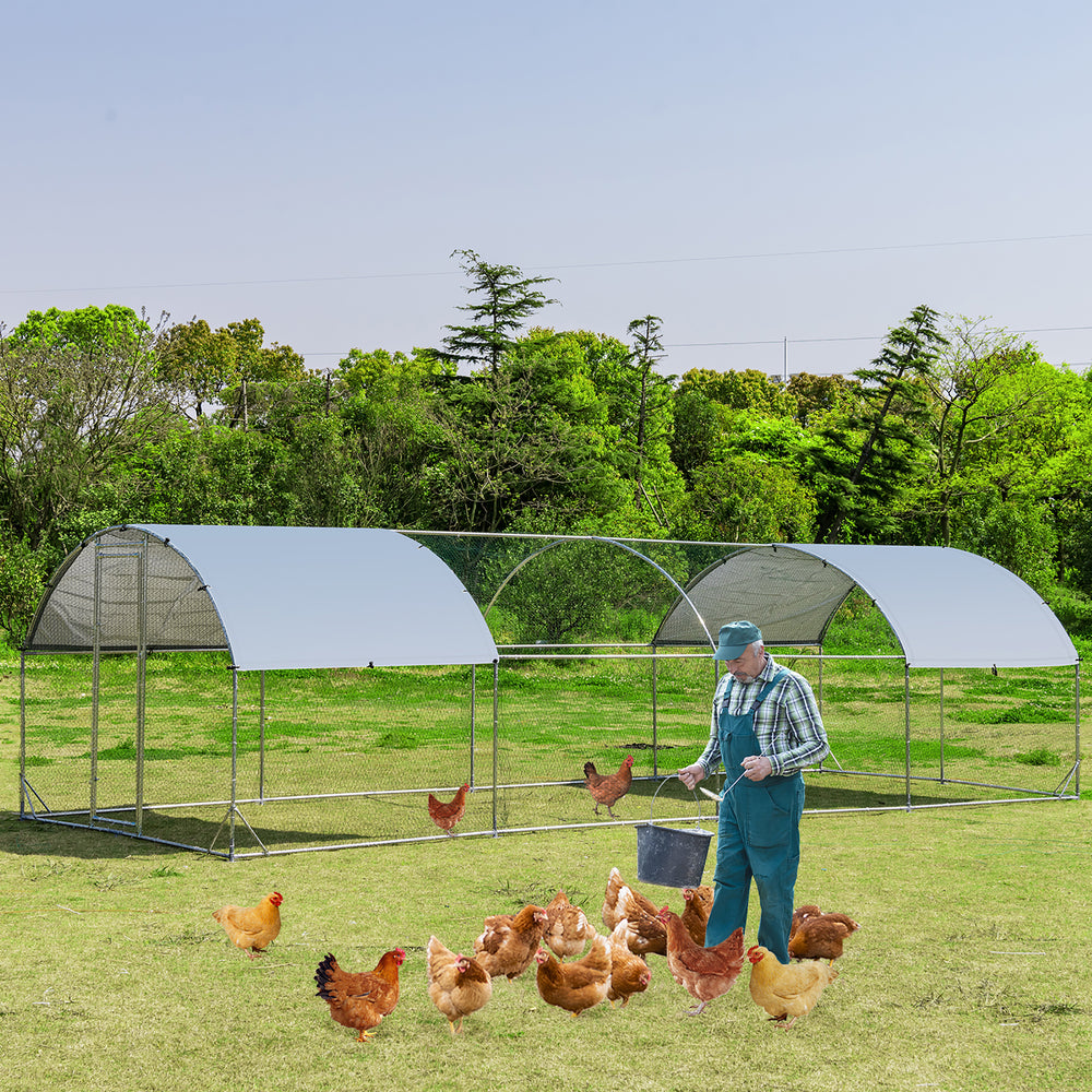 Large metal chicken coop with cover, featuring a sturdy galvanized steel frame and spacious design for backyard.