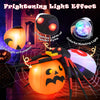 Inflatable spider on pumpkin with LED lights and colorful rotating light, ideal for Halloween backyard decoration.
