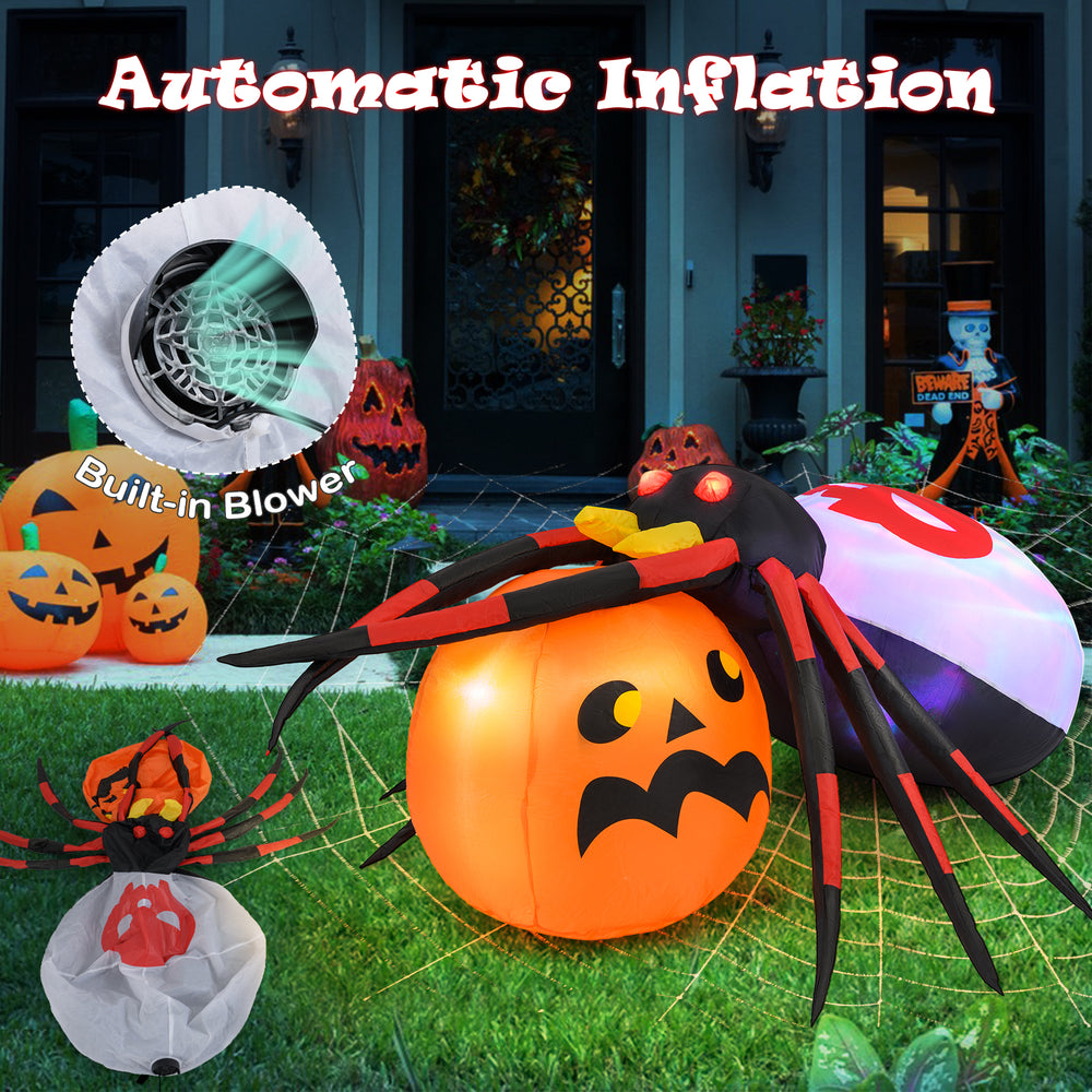 Inflatable spider on a pumpkin with colorful rotating lights, perfect for backyard Halloween decoration.