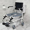 4-in-1 bedside commode wheelchair with detachable bucket, adjustable height, and waterproof PVC surface for comfort and.