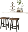 Solid wood saddle-seat stools with curved surfaces and footrests, perfect for kitchen or dining areas.