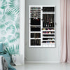 Wall mounted lockable jewelry cabinet with LED lights, full-length mirror, and spacious storage for accessories.