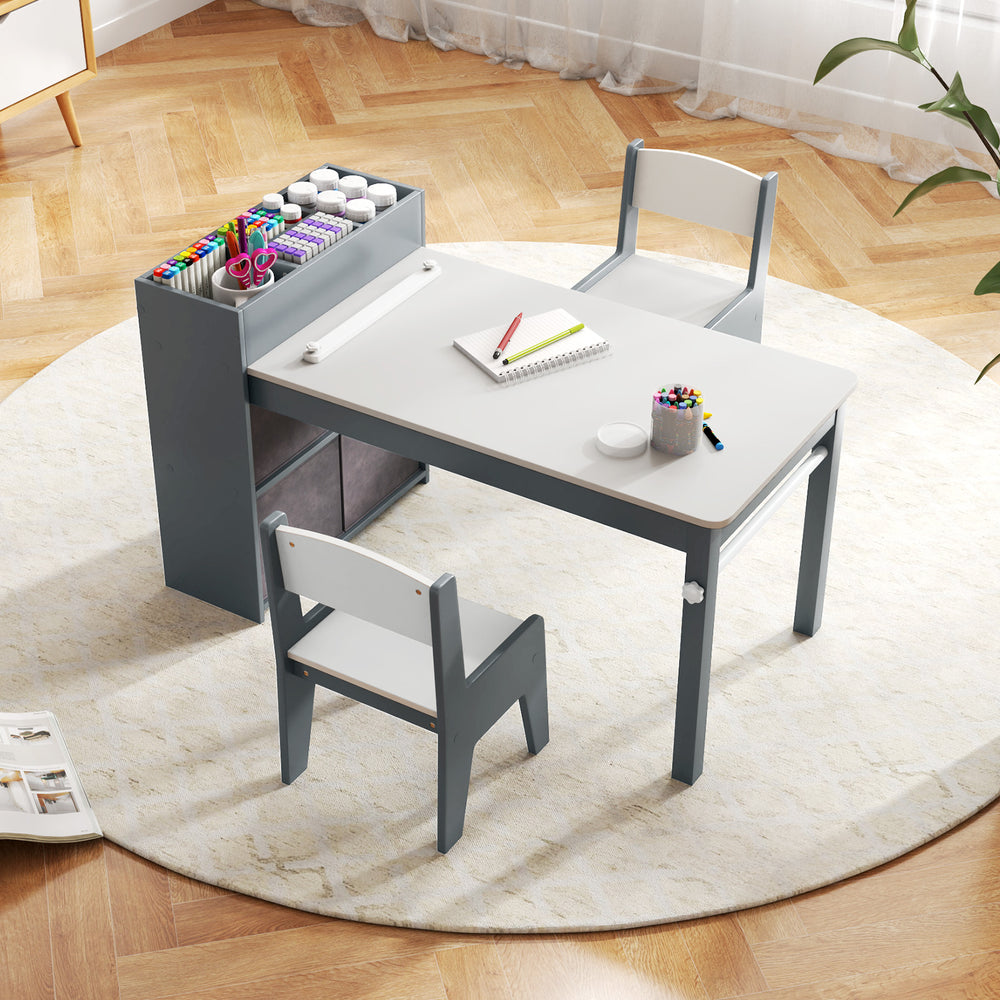 Kids art table set in gray with 2 ergonomic chairs, large tabletop, and storage bins for creative activities.