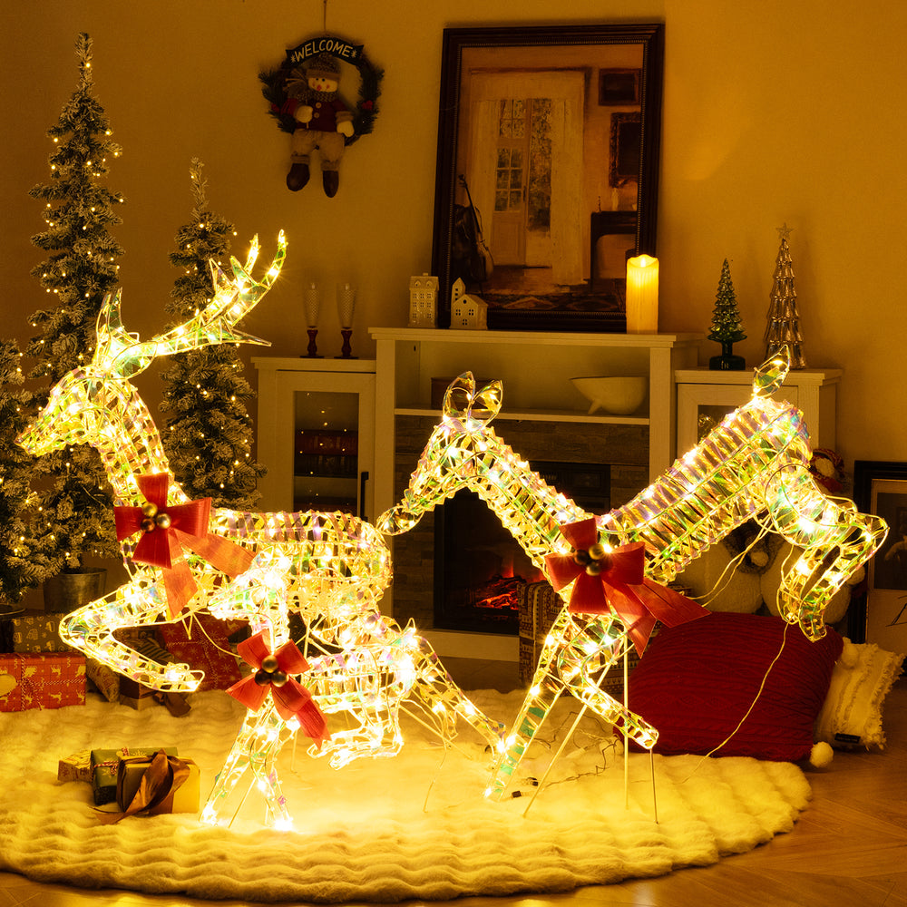 Lighted Christmas reindeer family with bows, featuring 230 LED lights for festive decoration in living room or yard.