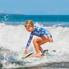 Lightweight boogie board with EPS core and XPE deck, perfect for kids surfing at the beach.