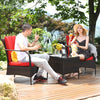 Patio conversation set featuring red cushioned chairs and glass top coffee table, perfect for outdoor relaxation.