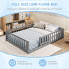 Montessori low floor bed in gray with full-length guardrails and safety door, promoting independence for children.
