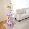 Multi-level cat tower featuring sisal scratching posts, cozy condos, and playful star and moon decorations for feline.