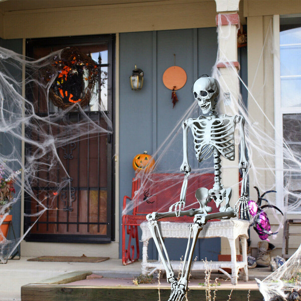Life-size 5.4-foot Halloween skeleton with movable joints, perfect for spooky outdoor decorations and Halloween parties.