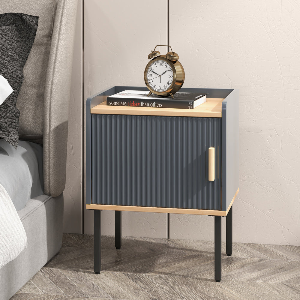 Gray nightstand with a single door cabinet and wooden handle, perfect for bedroom or living room storage.