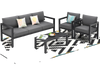 4-piece outdoor furniture set in gray with cushions, perfect for backyard and poolside relaxation.