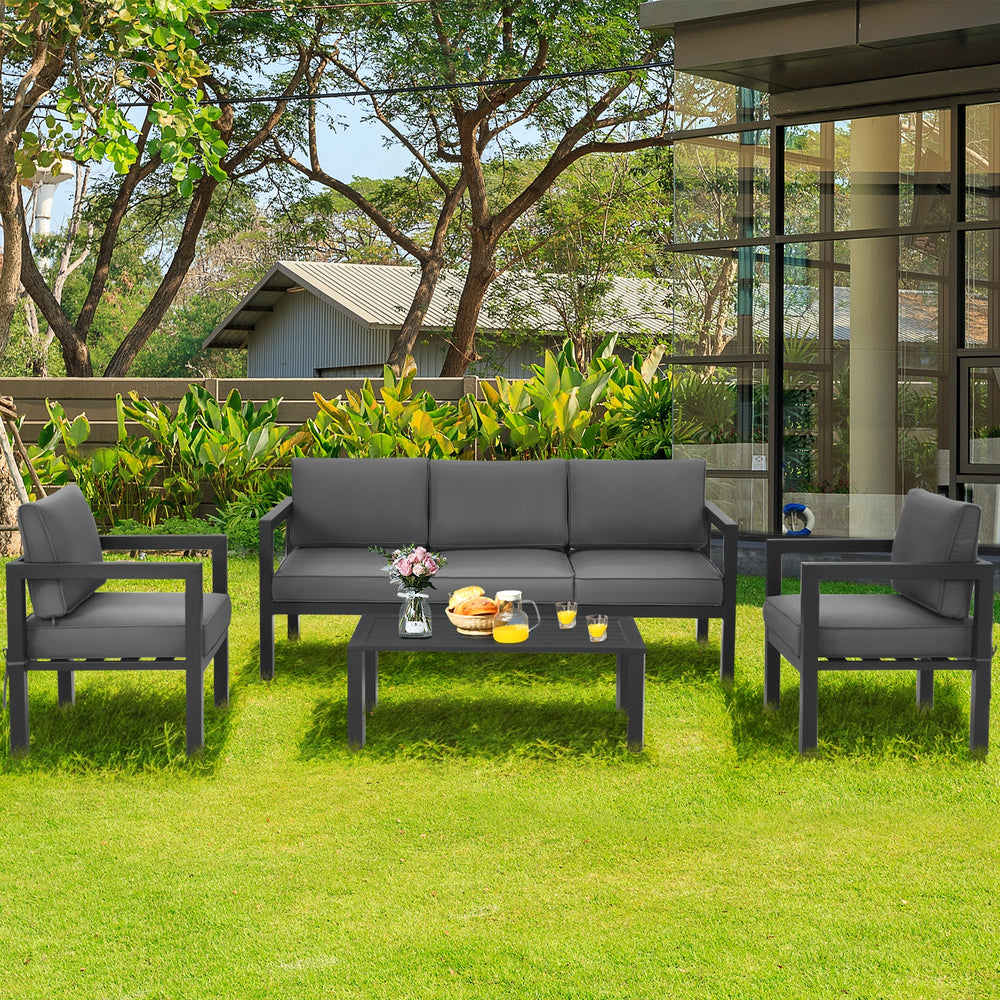 4-piece outdoor furniture set in gray with aluminum frame and soft cushions, perfect for backyard and poolside.