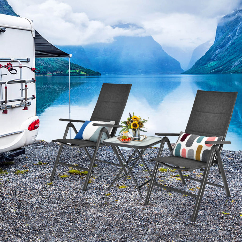 Square patio bistro table with rustproof frame and tempered glass top, perfect for outdoor use by the poolside.