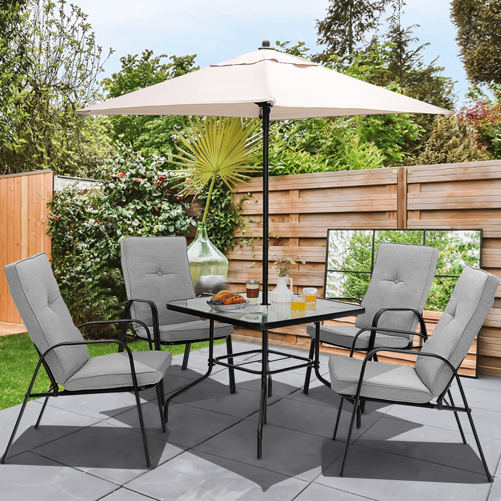Patio dining set featuring four stackable cushioned chairs and a large umbrella for outdoor comfort and shade.