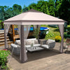 Pop-up gazebo tent with beige canopy and mesh screens, providing shade and ventilation for outdoor gatherings.