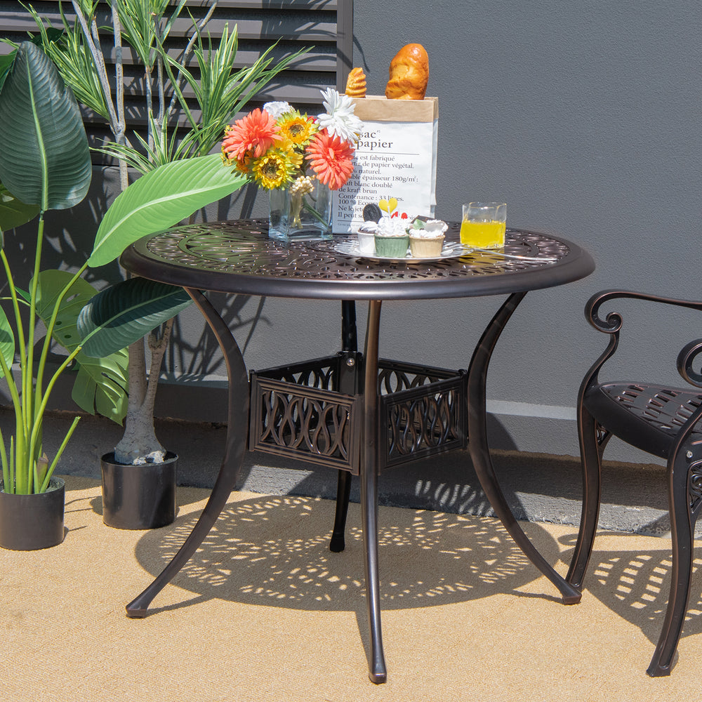 Round 36-inch brown patio dining bistro table with umbrella hole, featuring elegant patterns, ideal for outdoor use.