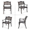 Two outdoor cast aluminum chairs with armrests, featuring a hollow-out design and adjustable foot pads for stability.