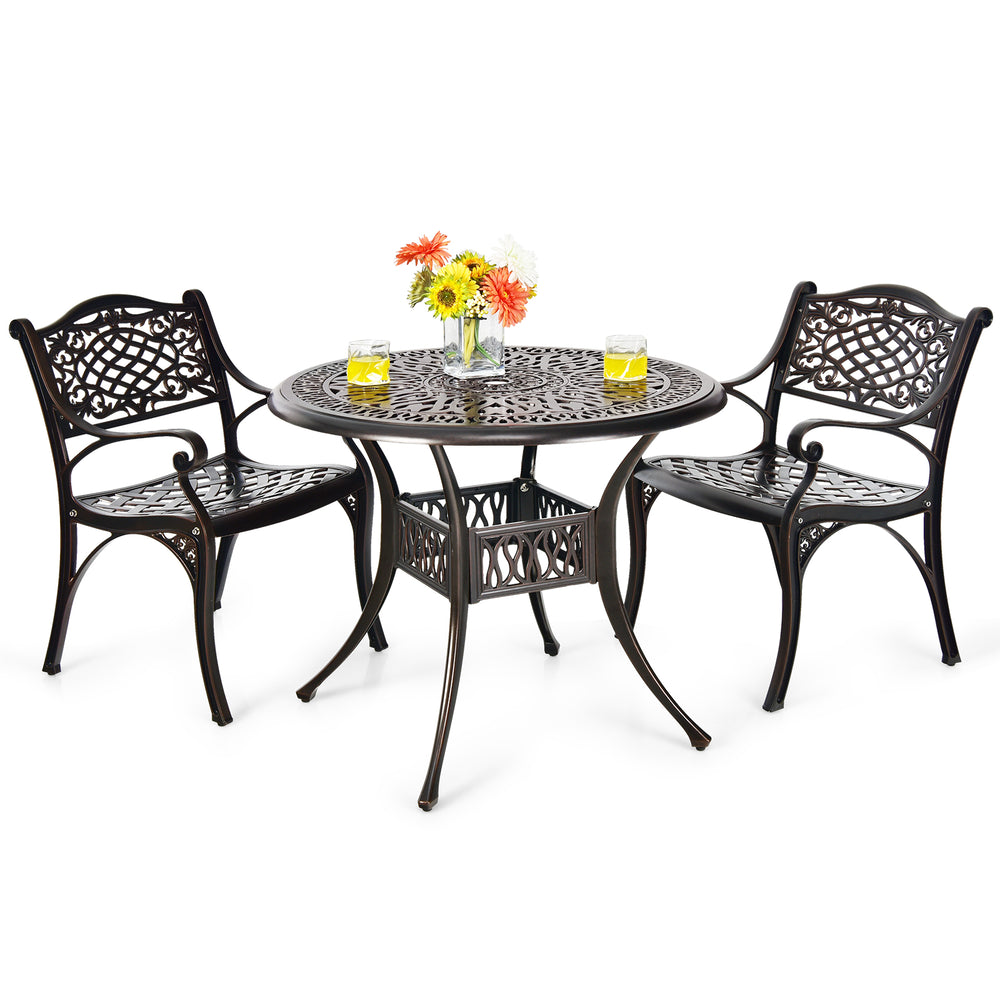Two outdoor cast aluminum chairs with armrests and a round table, perfect for patio or garden use.