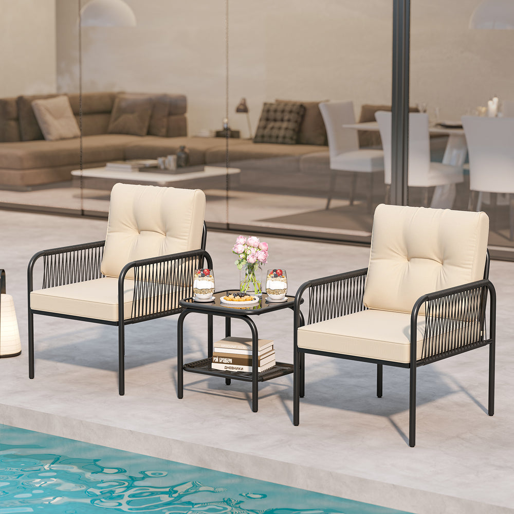 Two beige cushioned chairs and a glass-top table in a patio setting, perfect for outdoor conversations.