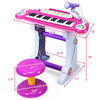 Kids' 37 key electronic keyboard piano in pink with microphone and stool, perfect for musical play and learning.