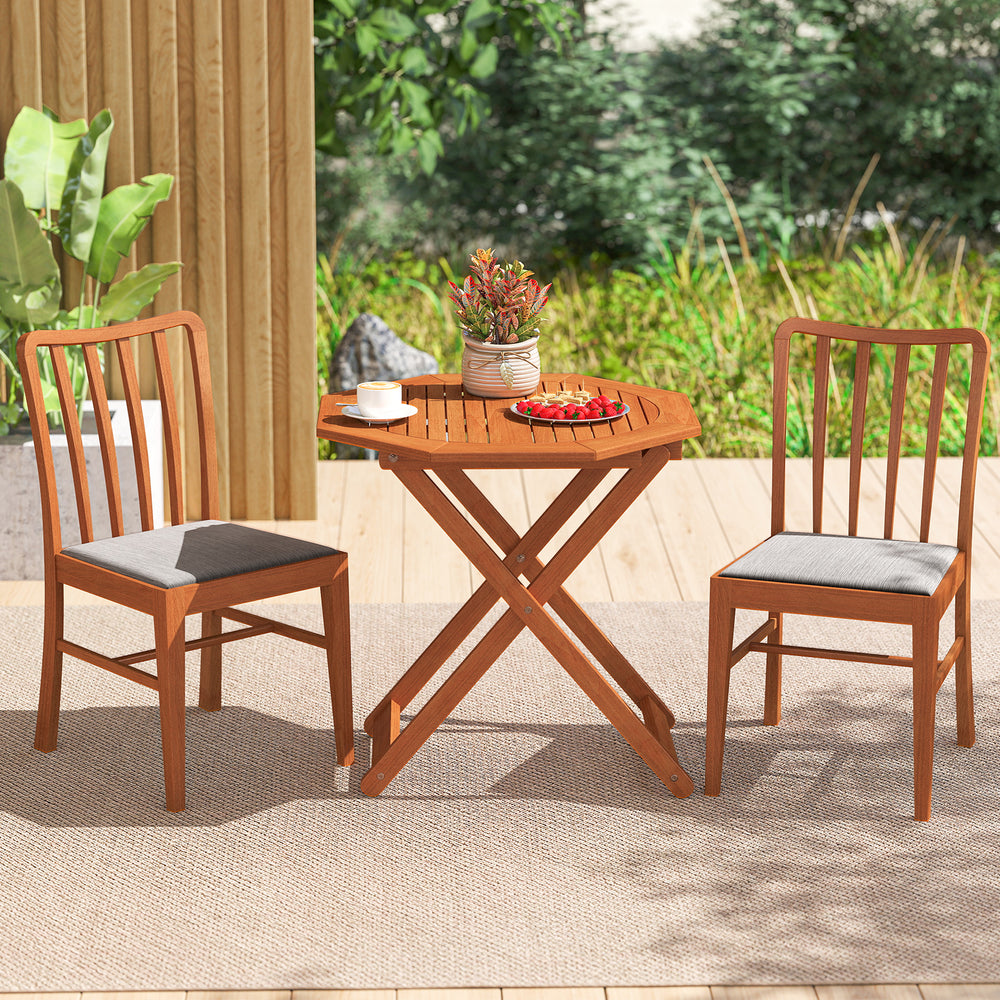 Octagon folding patio table with two chairs, made of solid wood, featuring a 2" umbrella hole for outdoor use.