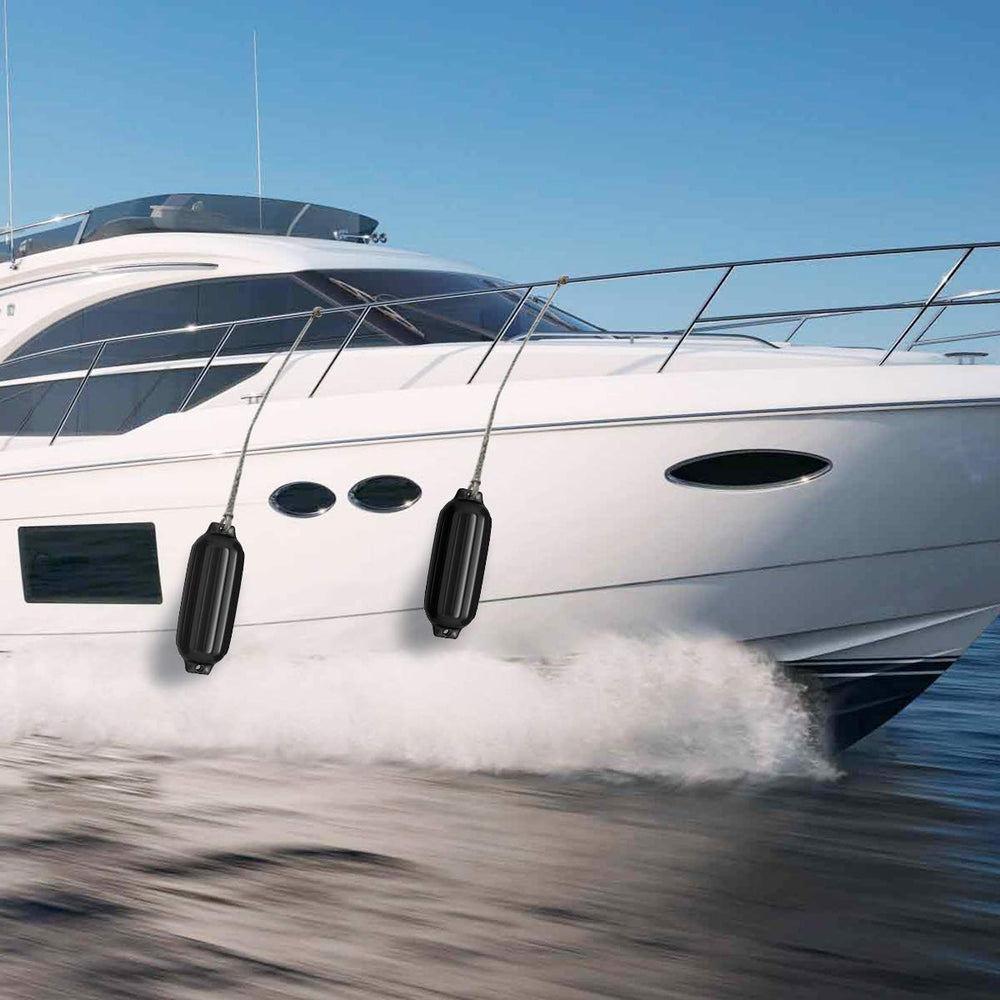 Black 8.5" x 27" ribbed marine boat fender, designed for dock protection and UV resistance, shown on a boat.