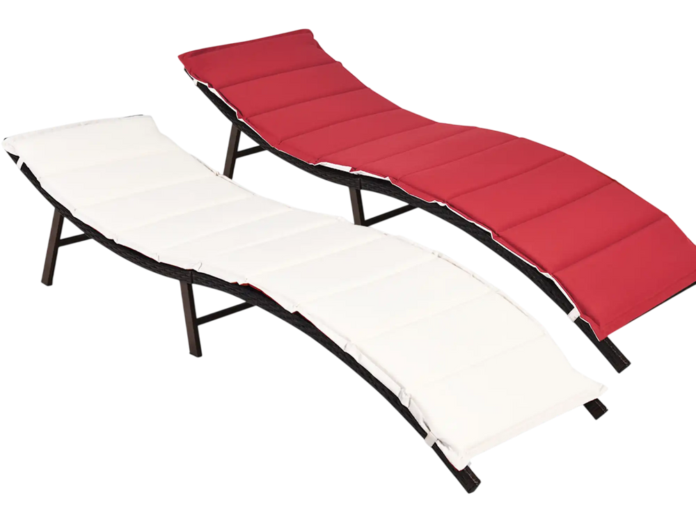 Folding patio lounger chairs in red and beige with premium wicker, ideal for poolside and outdoor relaxation.