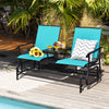 Two-person turquoise rocking loveseat with tempered glass table, perfect for outdoor relaxation by the pool.