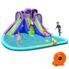 Inflatable water park with a tall slide, splashing pool, and water cannon for kids' summer fun in the backyard.