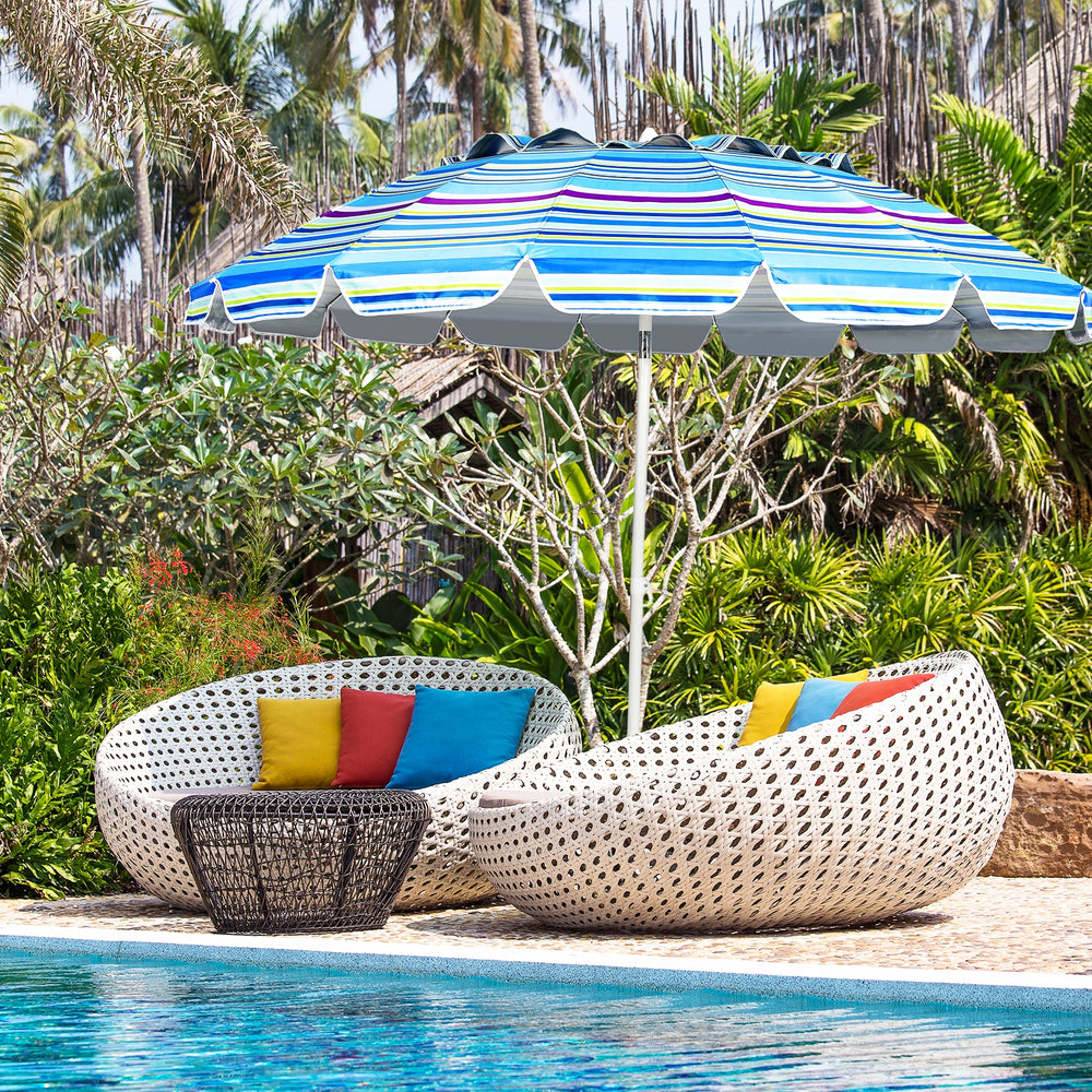 8FT portable beach umbrella with tilt mechanism and sand anchor, providing shade by the poolside for summer relaxation.