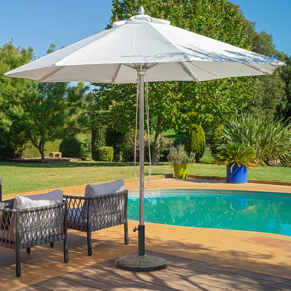 Patio resin umbrella base with wicker style, 22 lbs, designed for stability and compatibility with 1.5" or 1.9" poles.